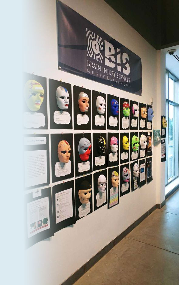 A display of masks made in a Brain Injury Services program.